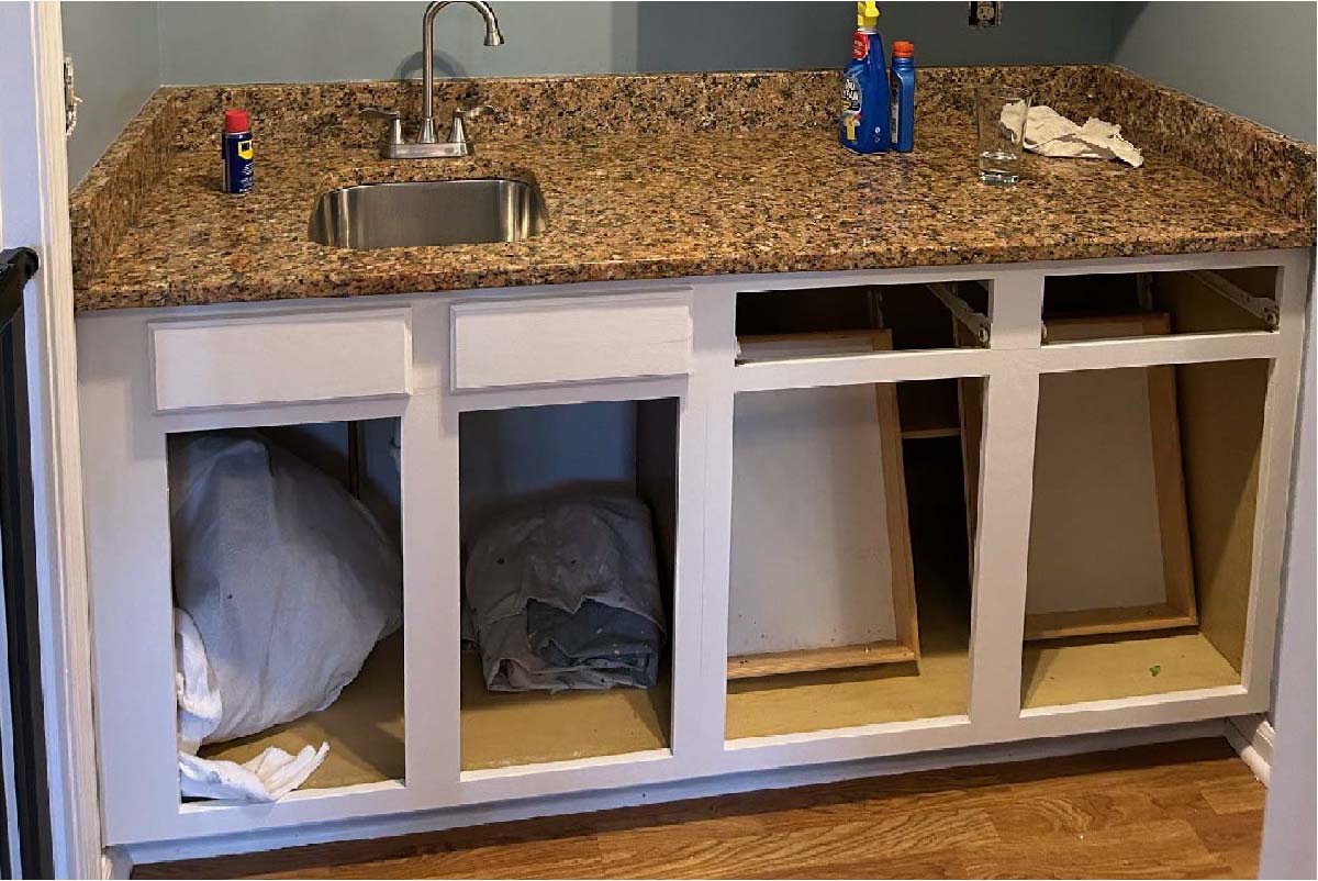 The after pictures of the sink without cabinets